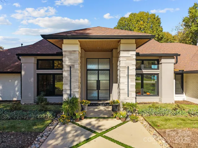 a front view of a house with garden