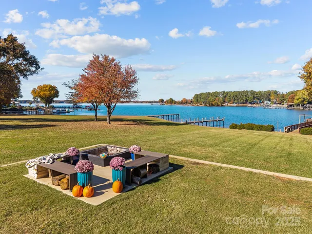 a view of a lake with houses in the back