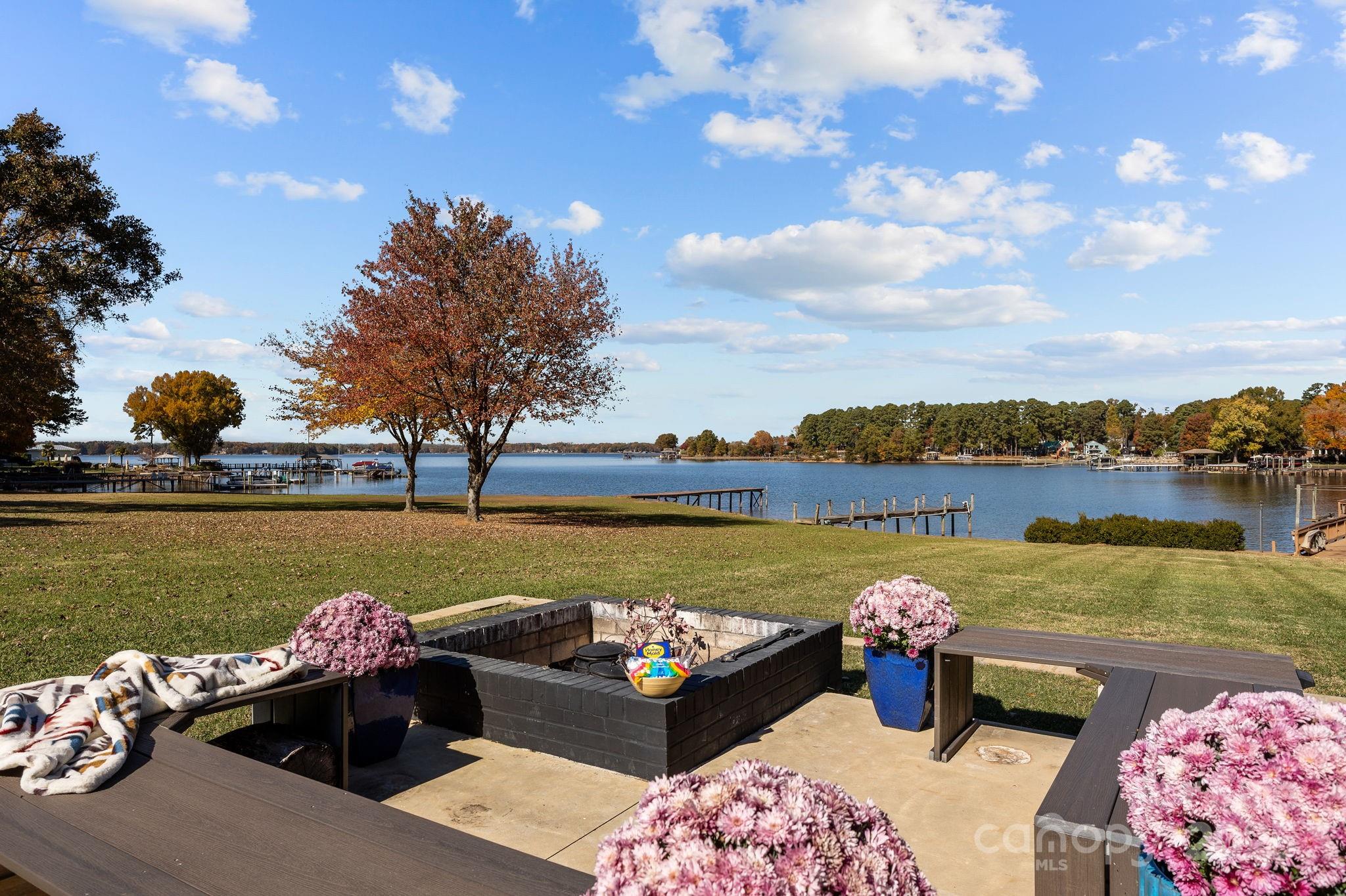 21400 Bethel Church Road Cornelius, NC 28031 - Photo 45 of 47 a view of a lake with couches chair and city view