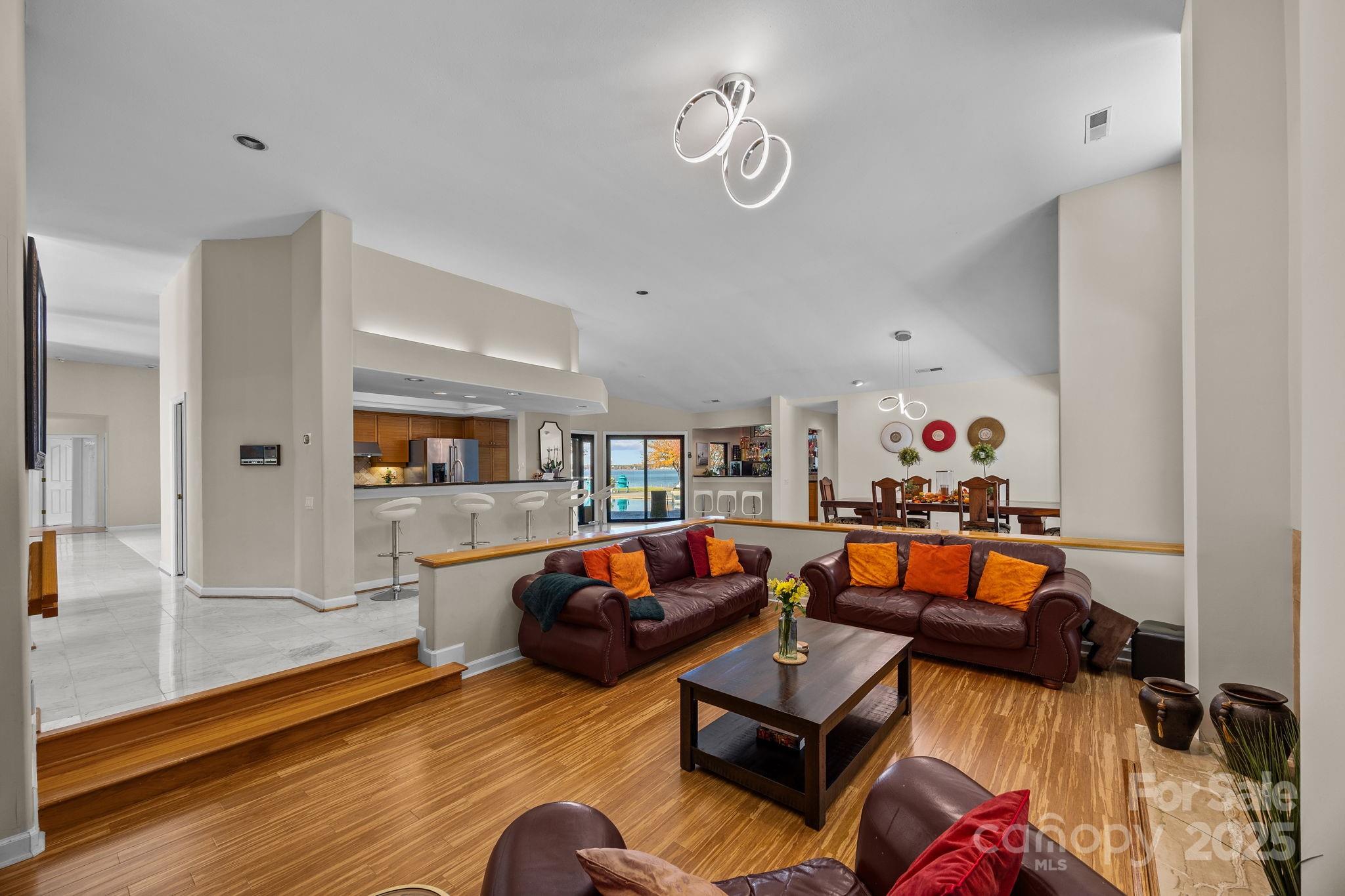 21400 Bethel Church Road Cornelius, NC 28031 - Photo 10 of 47 a living room with furniture and a wooden floor