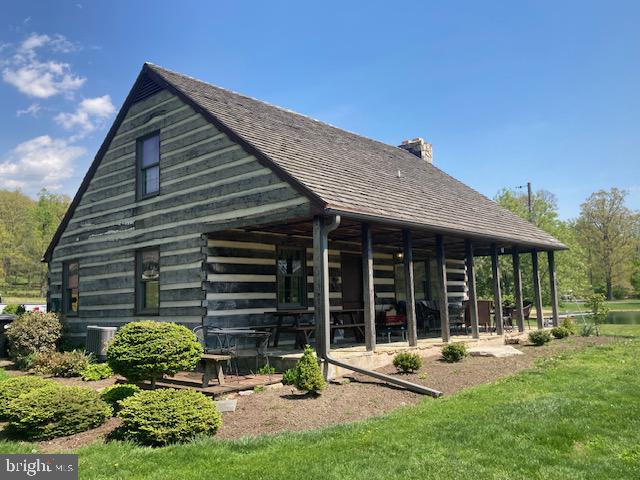 227 Lowry Road New Holland, PA 17557 - Photo 5 of 21 a backyard of a house with outdoor seating and barbeque oven