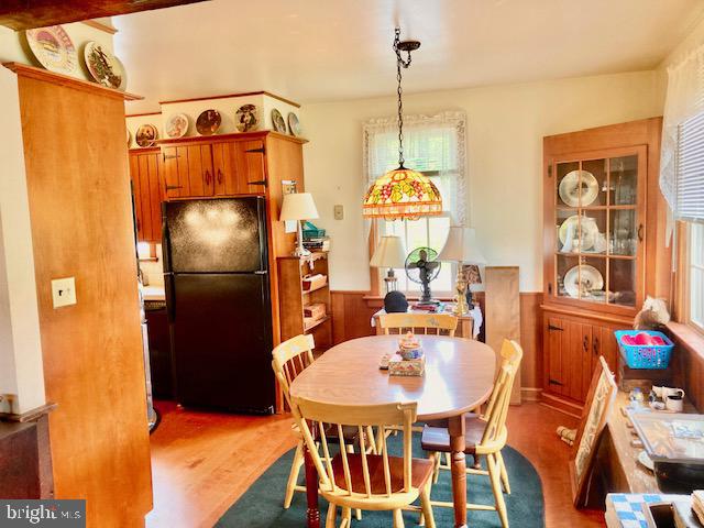 227 Lowry Road New Holland, PA 17557 - Photo 10 of 21 a dining table with chairs and a chandelier