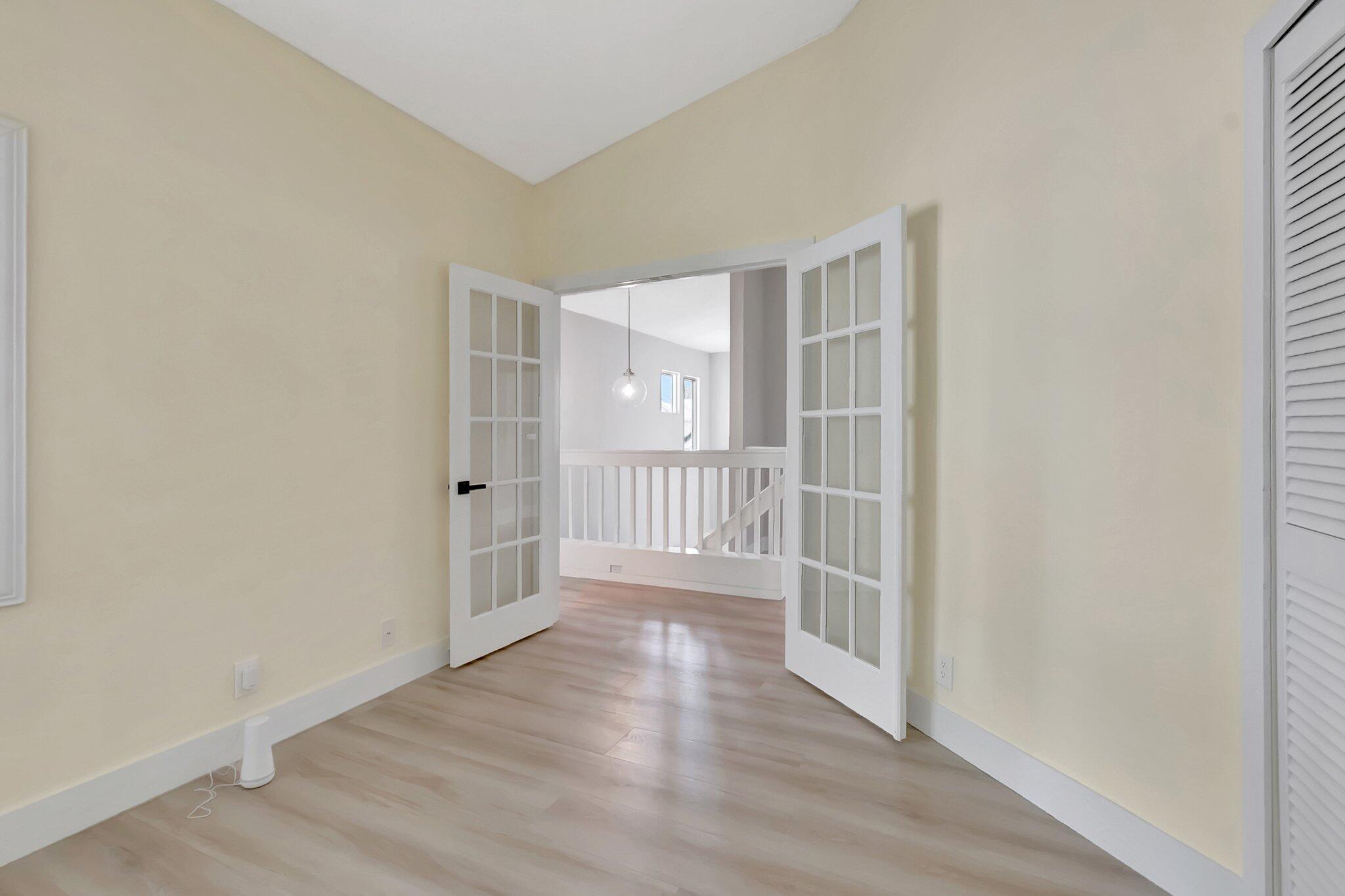 23228 Fountain View Drive, Unit B Boca Raton, FL 33433 - Photo 33 of 49 French doors lead to 3rd bedroom/office