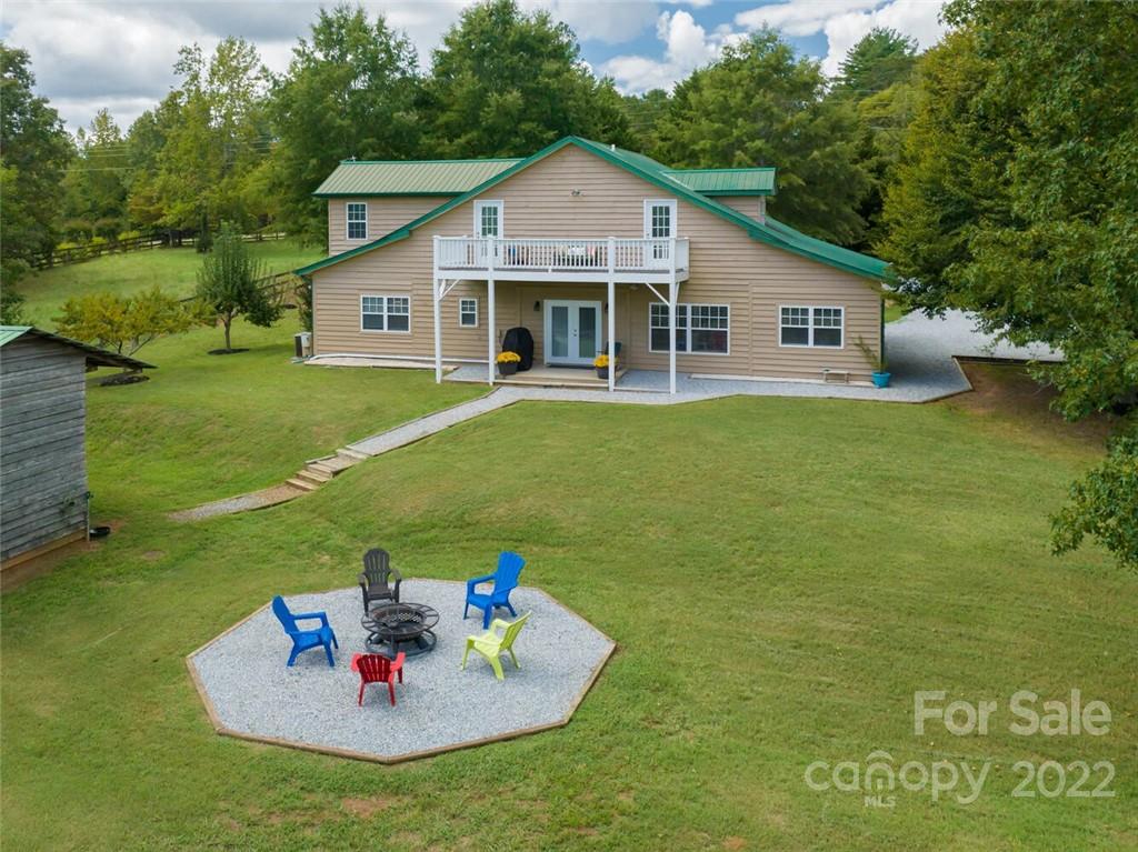 2251 Golf Course Road Columbus, NC 28722 - Photo 40 of 44 a front view of house with an outdoor space and seating area