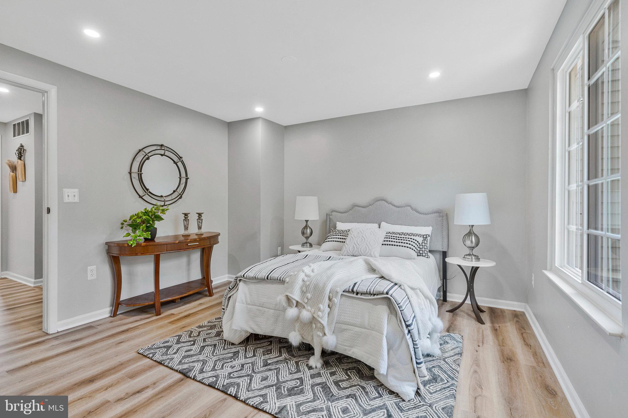 1628 Barnstead Drive Reston, VA 20194 - Photo 17 of 41 a bedroom with a bed and a table