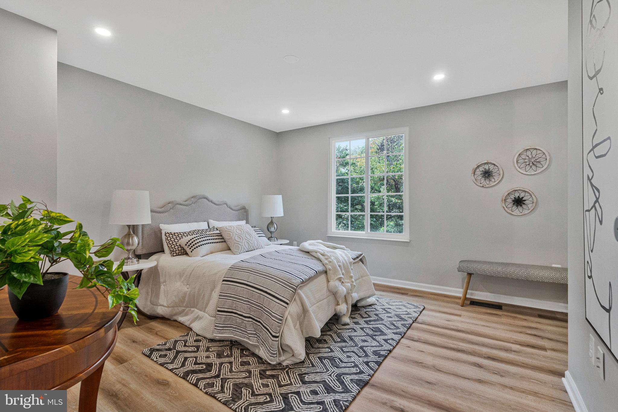 1628 Barnstead Drive Reston, VA 20194 - Photo 18 of 41 a bedroom with a bed and a window