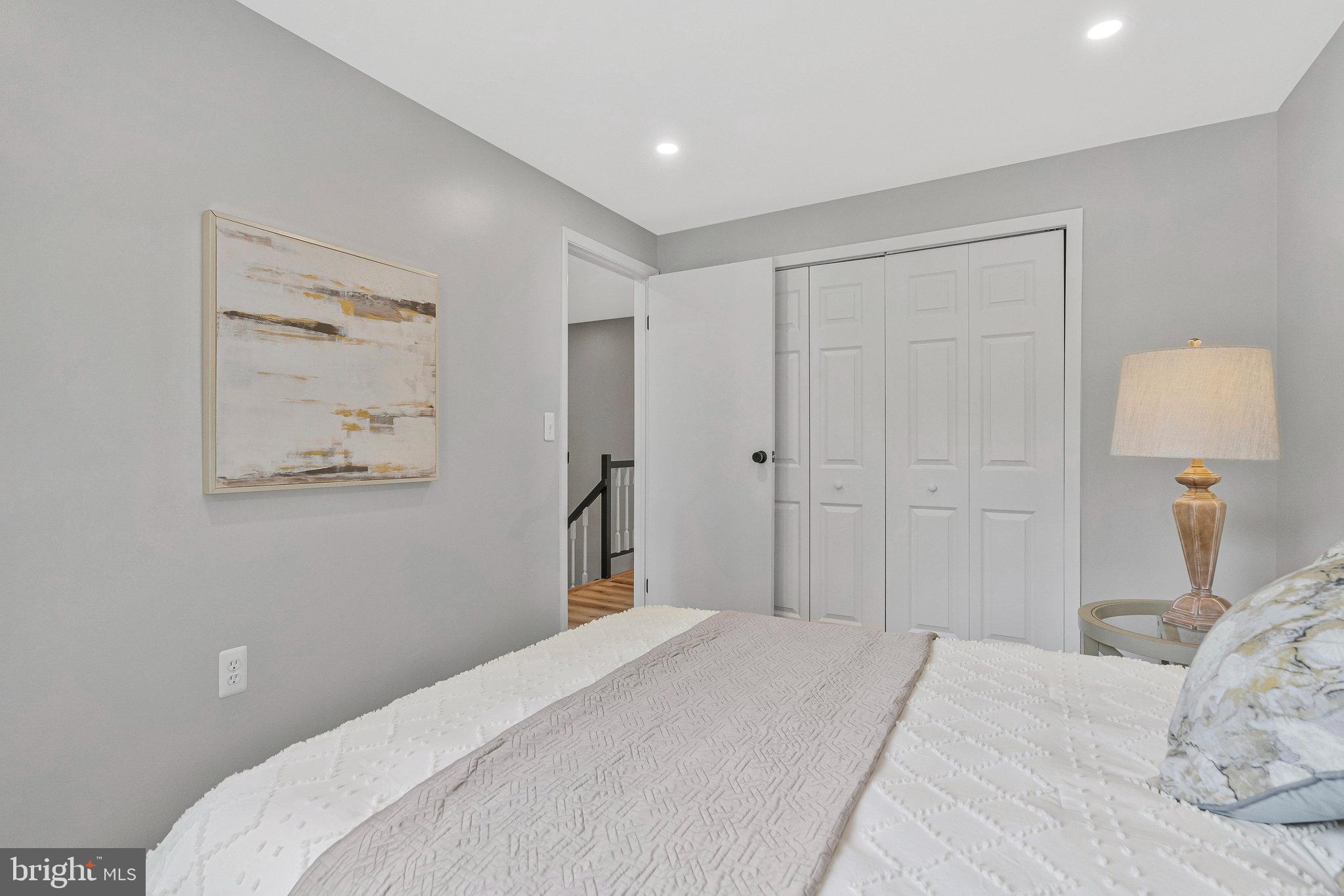 1628 Barnstead Drive Reston, VA 20194 - Photo 23 of 41 a bedroom with a bed and a painting on the wall