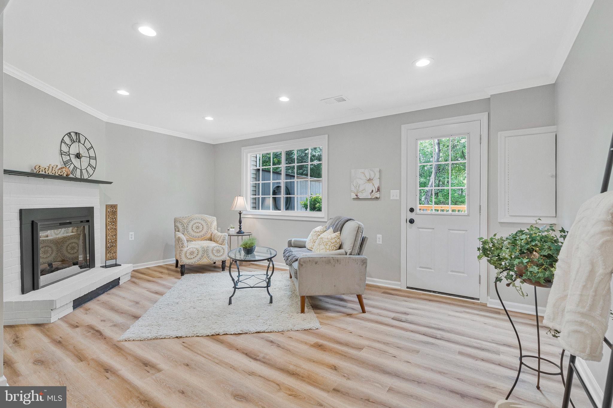 1628 Barnstead Drive Reston, VA 20194 - Photo 28 of 41 a living room with furniture and a fireplace