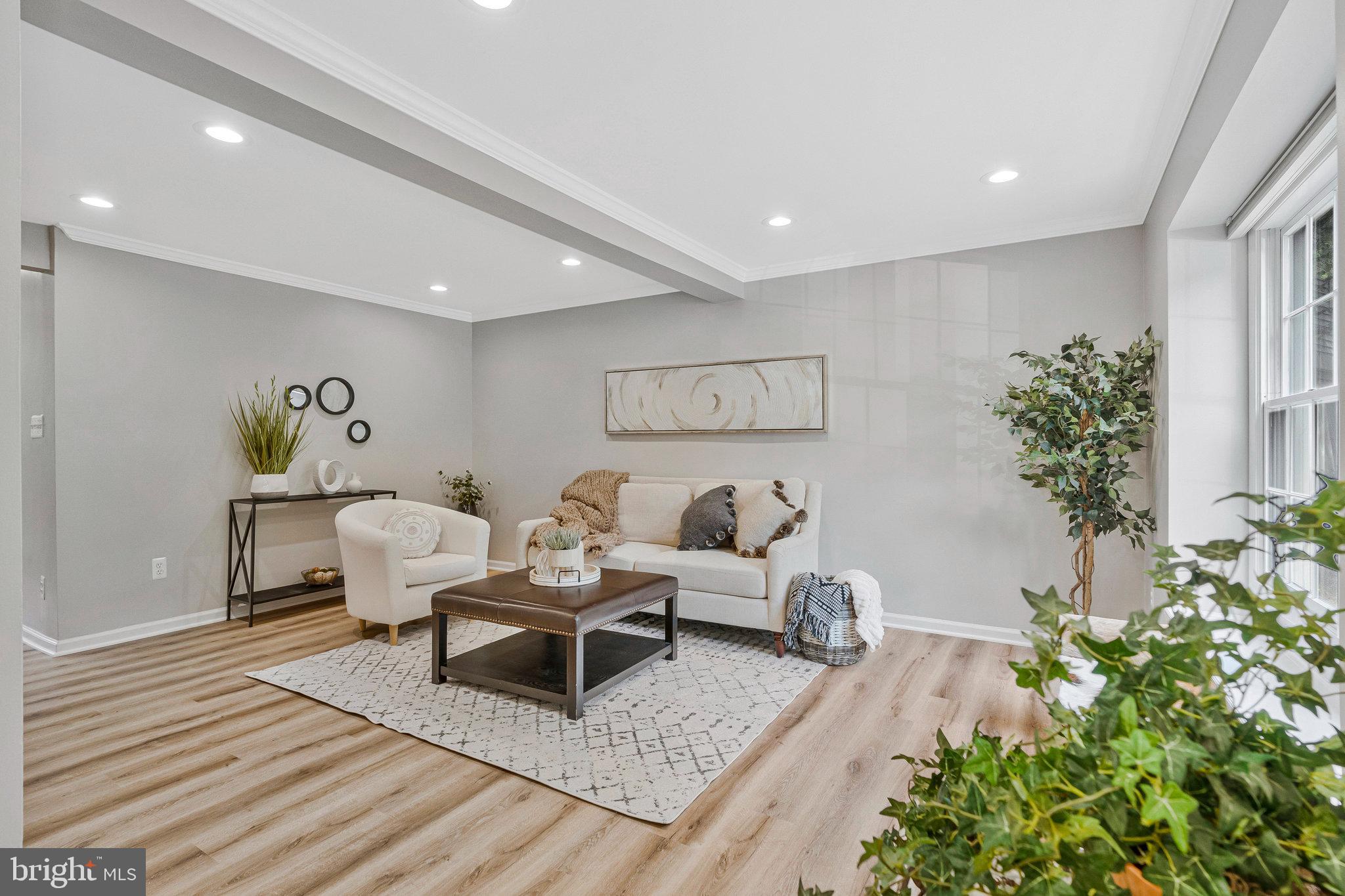 1628 Barnstead Drive Reston, VA 20194 - Photo 7 of 41 a living room with furniture and flowers