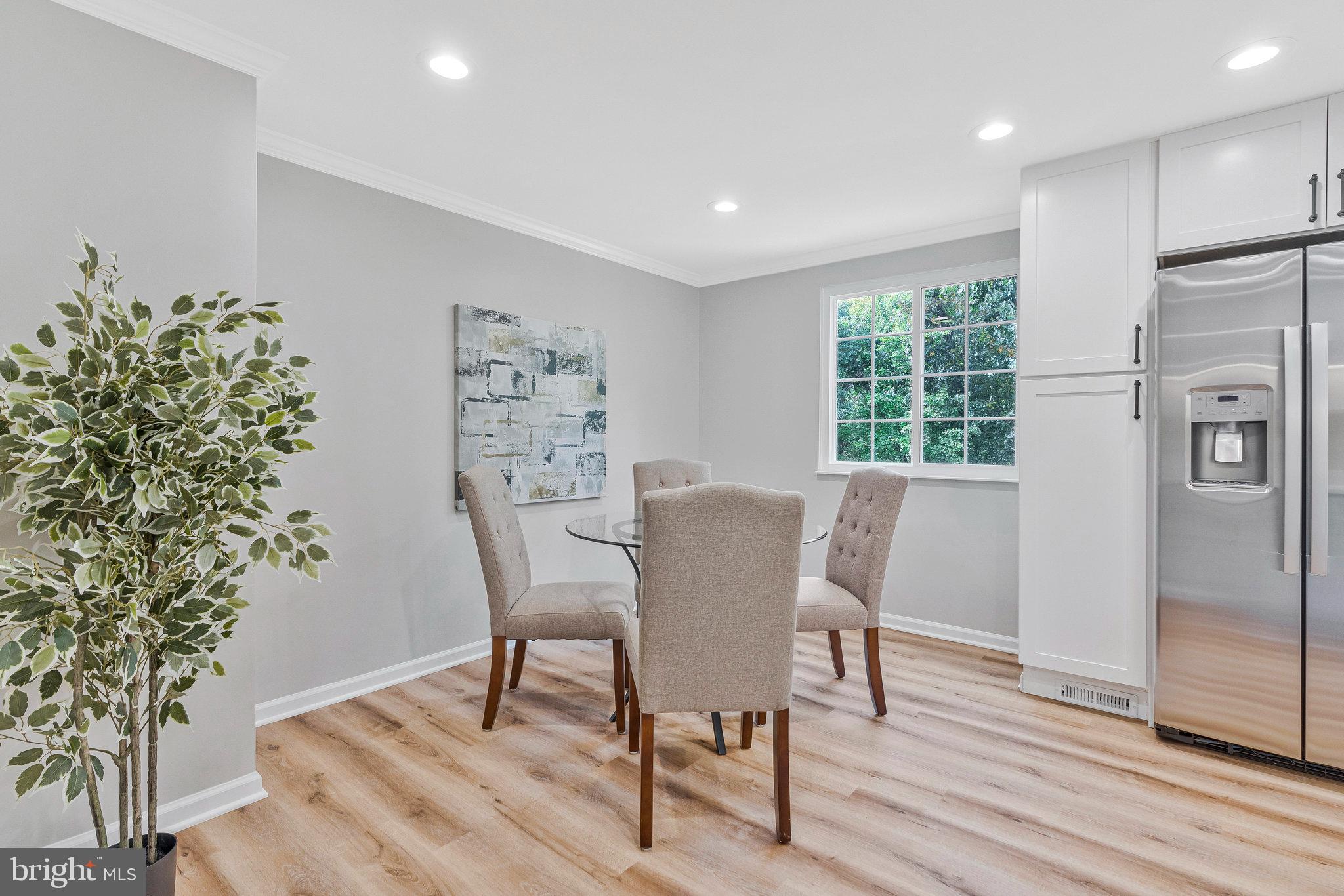 1628 Barnstead Drive Reston, VA 20194 - Photo 10 of 41 a view of a dining room with furniture window and wooden floor