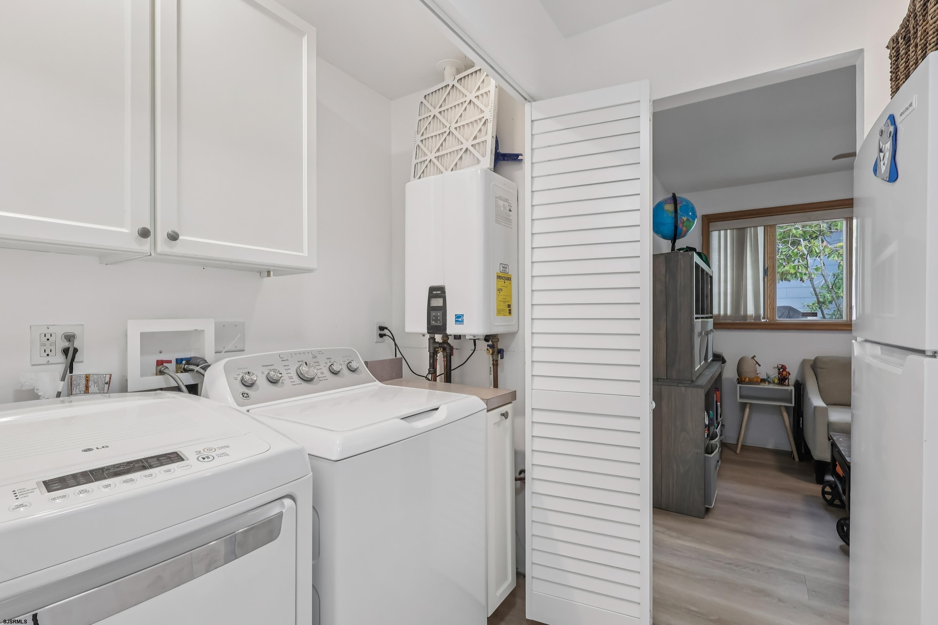 746 4th Street Somers Point, NJ 08244 - Photo 15 of 39 a utility room with dryer and washer