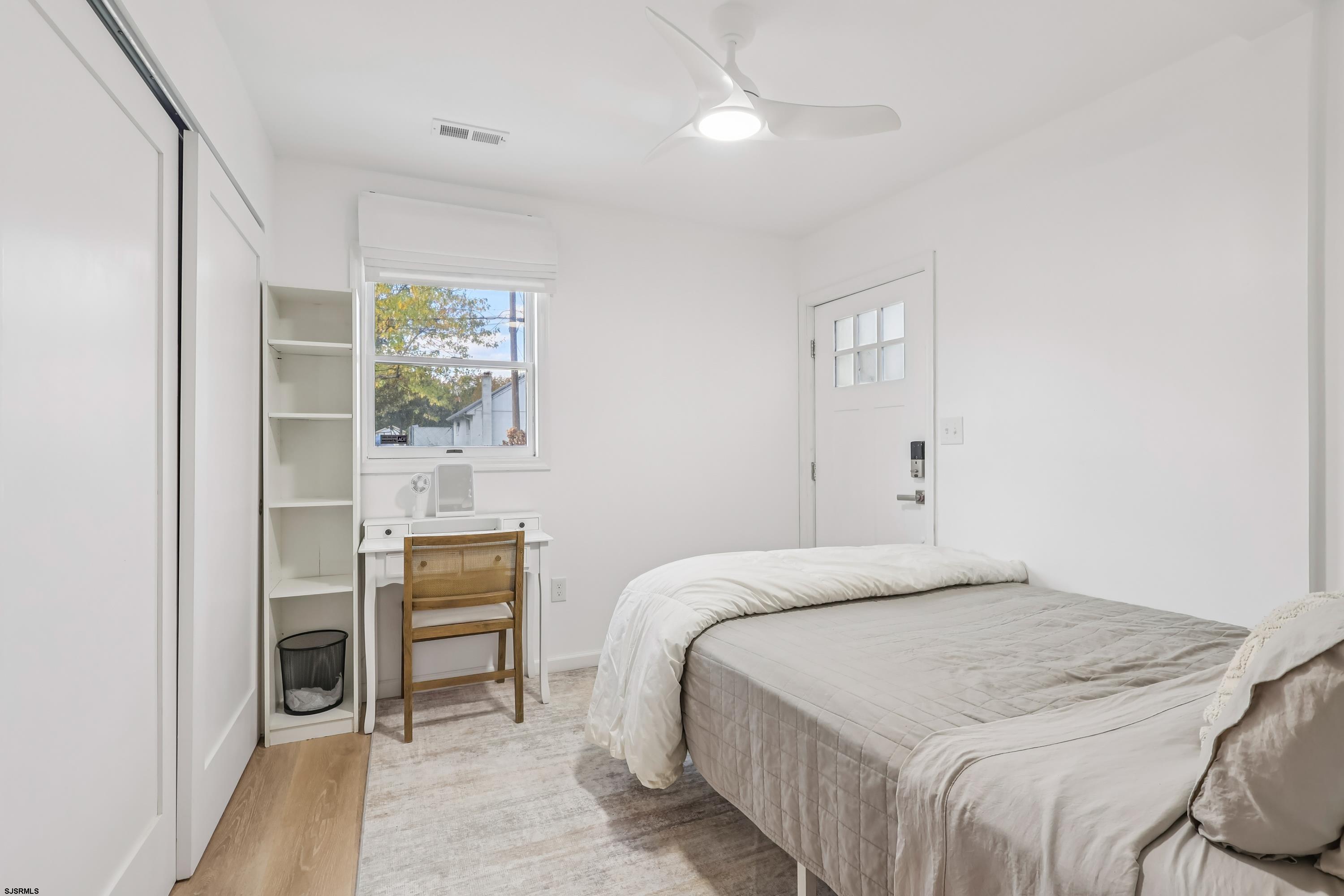 746 4th Street Somers Point, NJ 08244 - Photo 17 of 39 a bedroom with a bed and a window