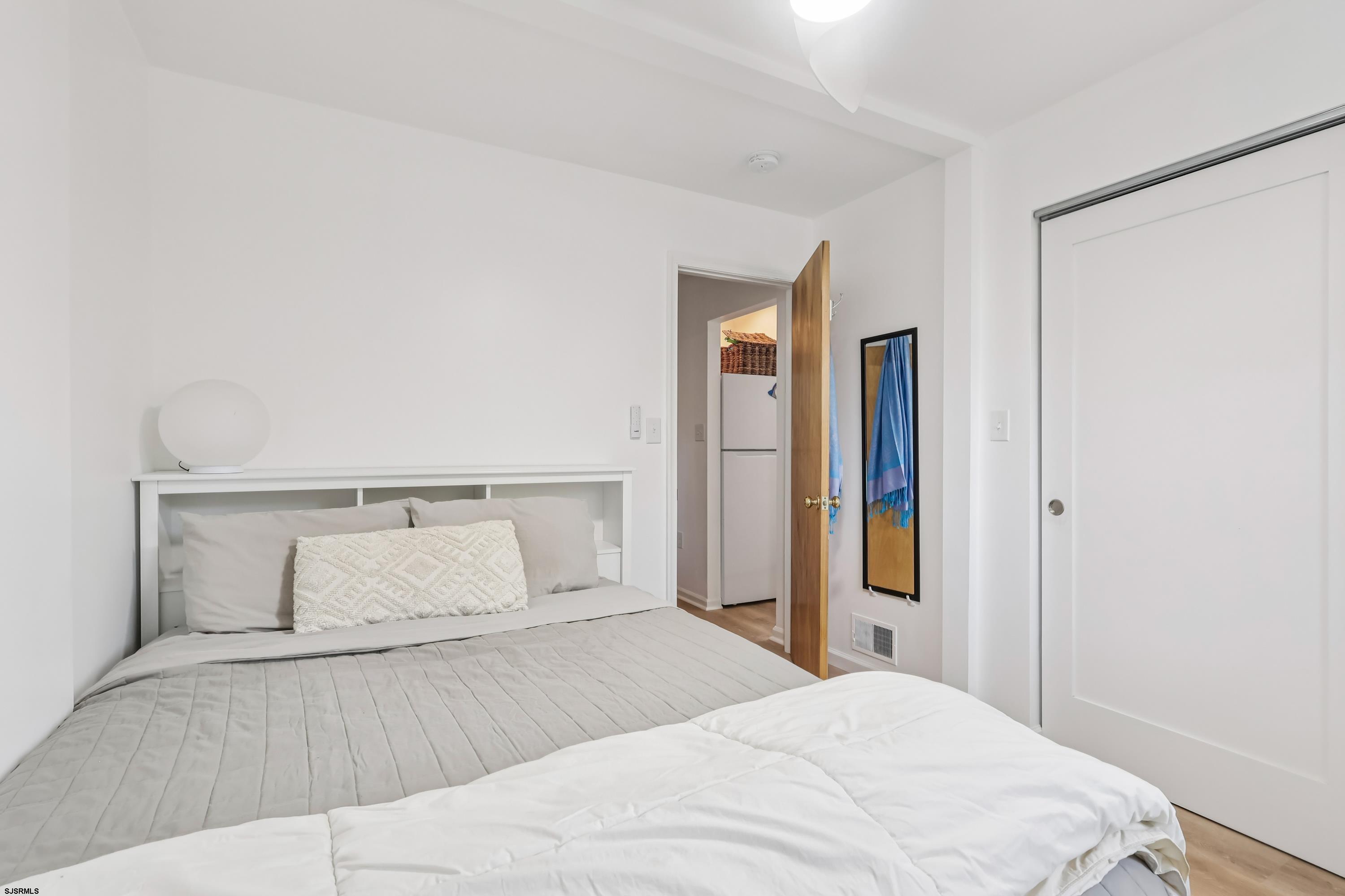 746 4th Street Somers Point, NJ 08244 - Photo 18 of 39 a bedroom with a bed and closet