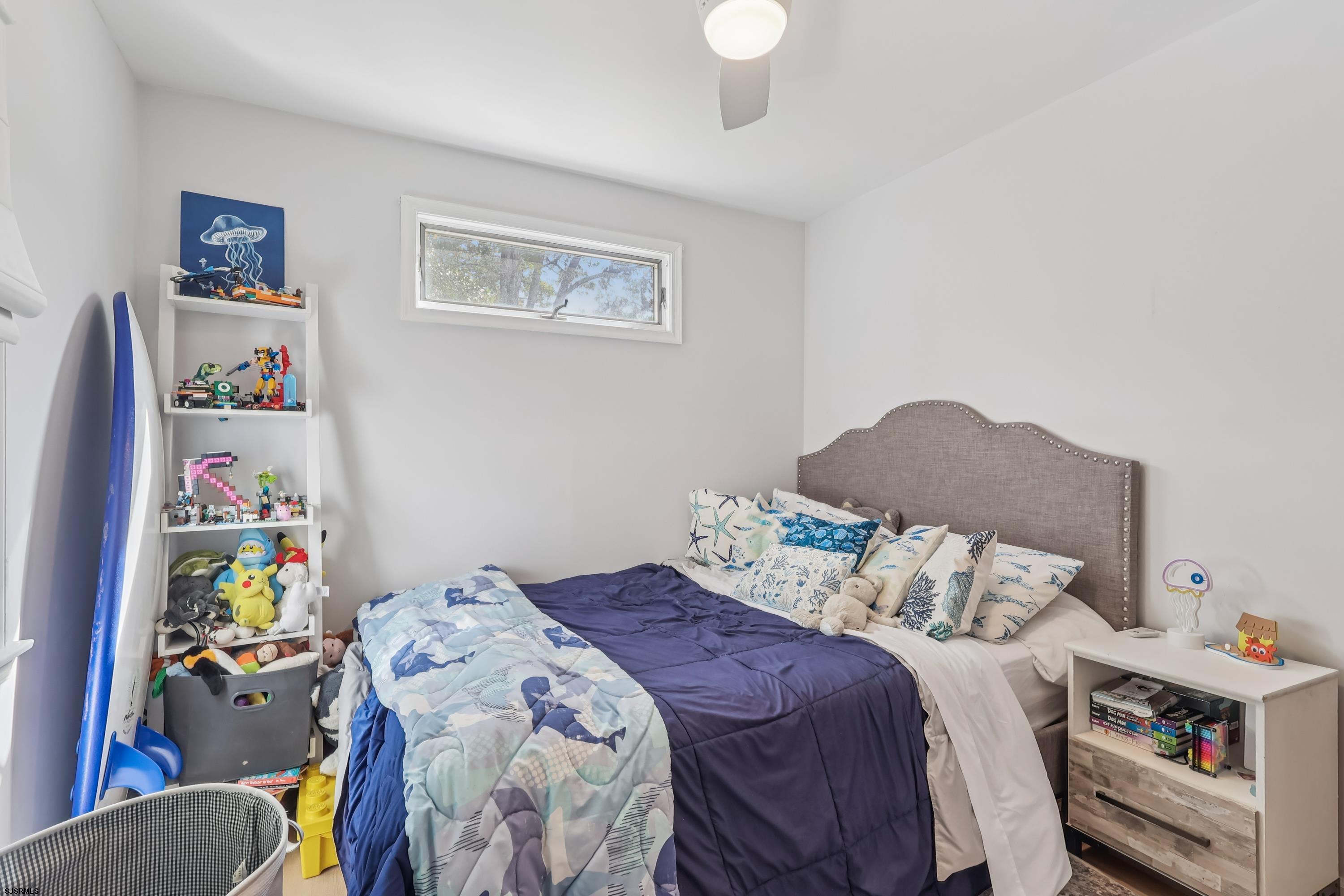 746 4th Street Somers Point, NJ 08244 - Photo 19 of 39 a bedroom with a bed and a window