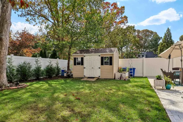 a view of a backyard with a sitting area