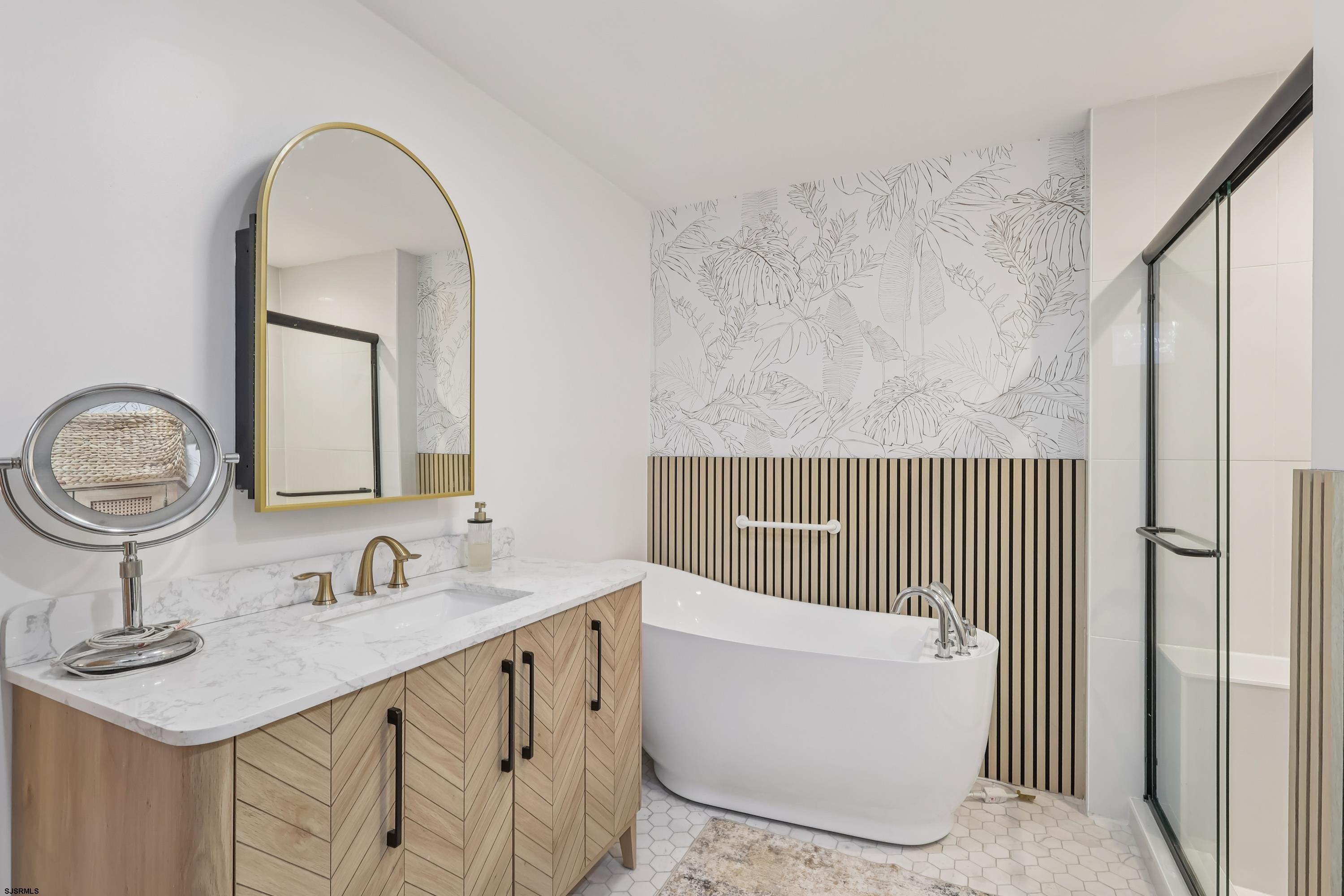 746 4th Street Somers Point, NJ 08244 - Photo 24 of 39 a bathroom with a sink and a mirror