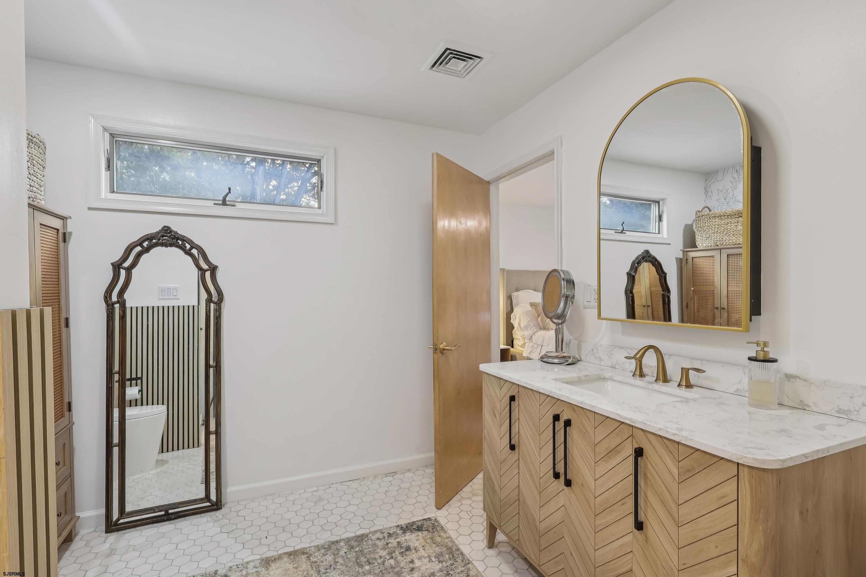 746 4th Street Somers Point, NJ 08244 - Photo 25 of 39 a bathroom with 2 sink and a mirror