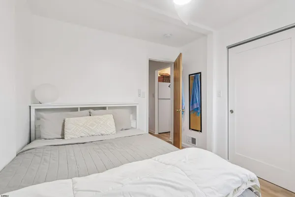 a bedroom with a bed and closet