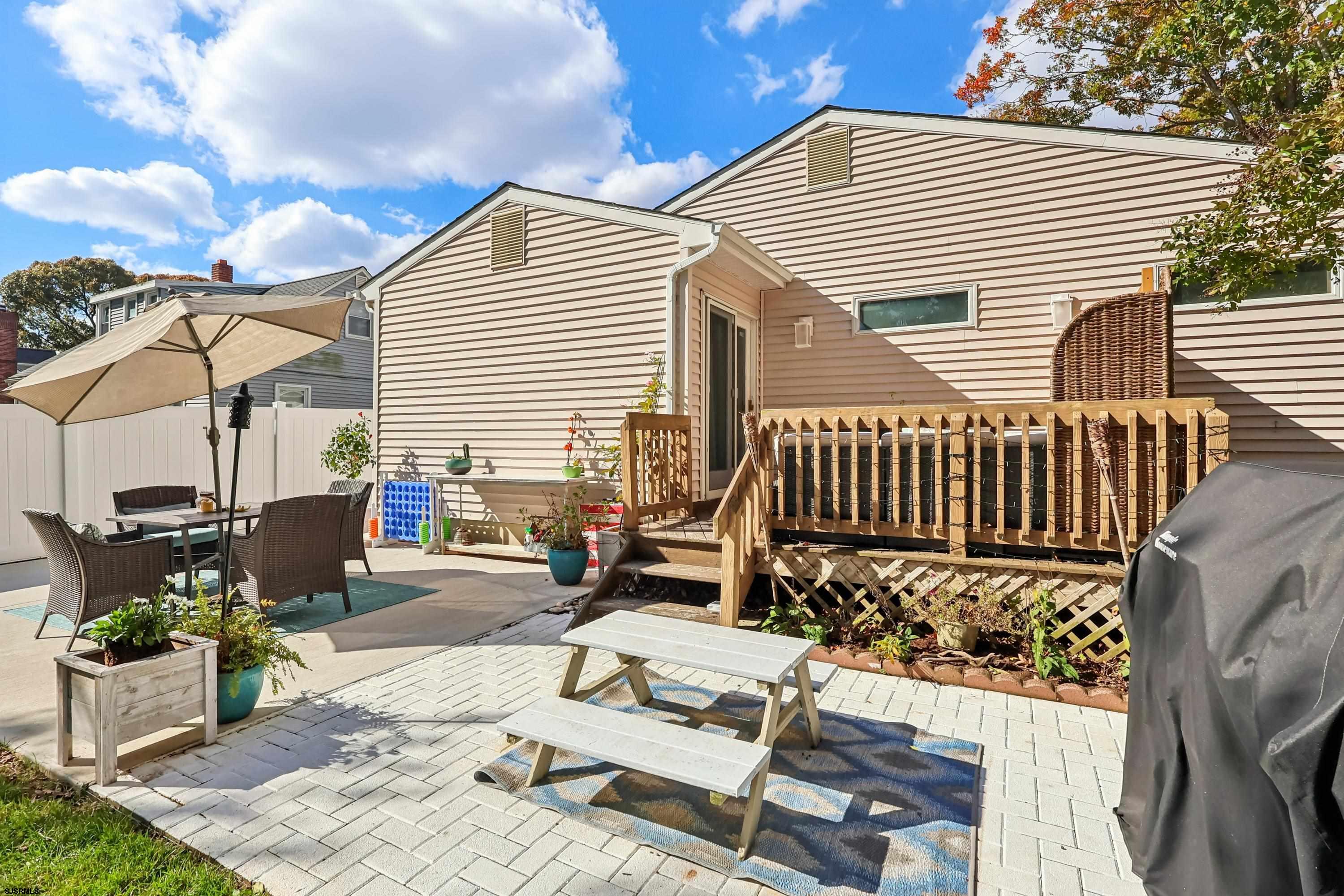 746 4th Street Somers Point, NJ 08244 - Photo 35 of 39 a view of a patio with a table and chairs