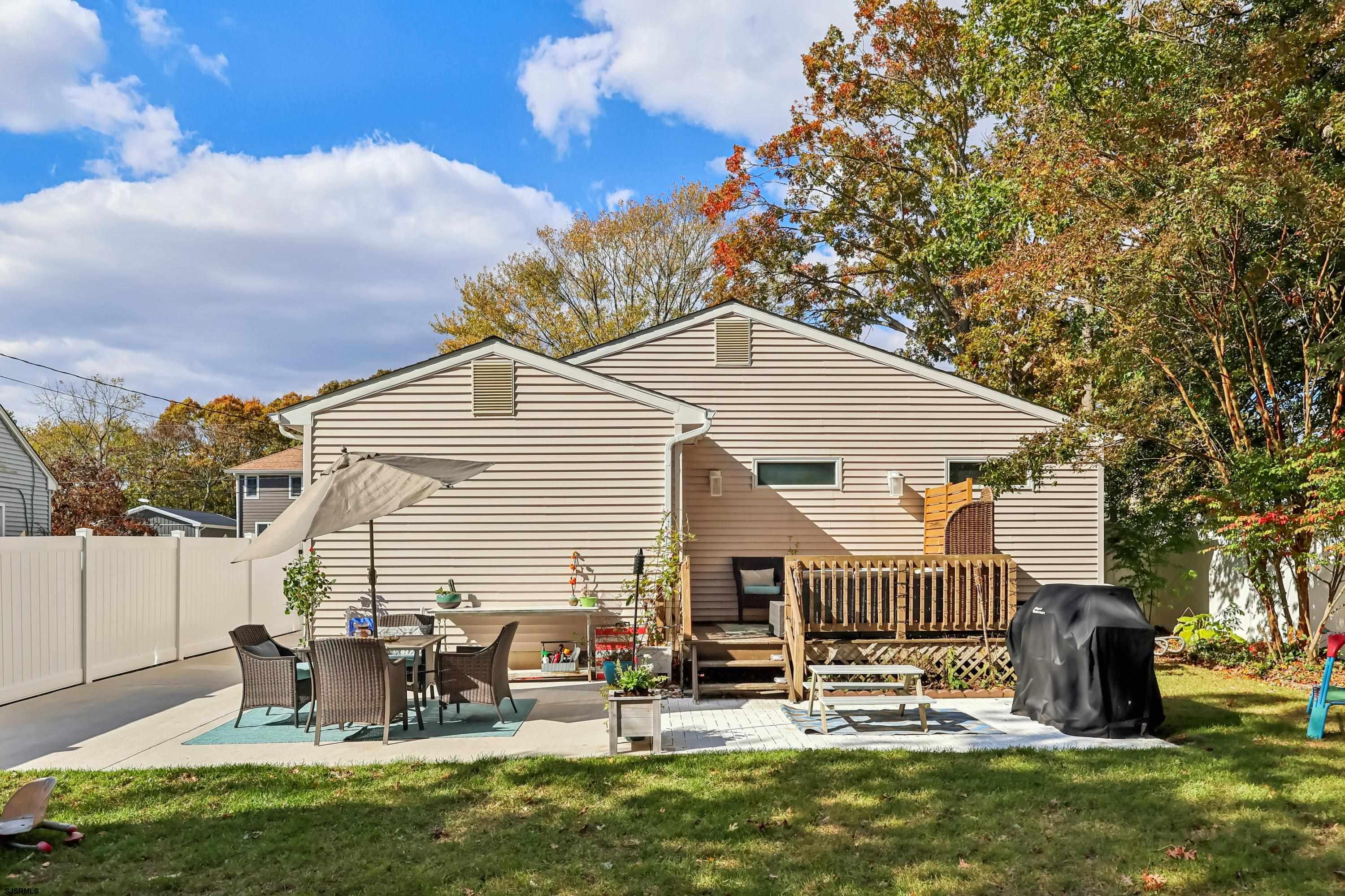 746 4th Street Somers Point, NJ 08244 - Photo 36 of 39 a backyard of a house with table and chairs