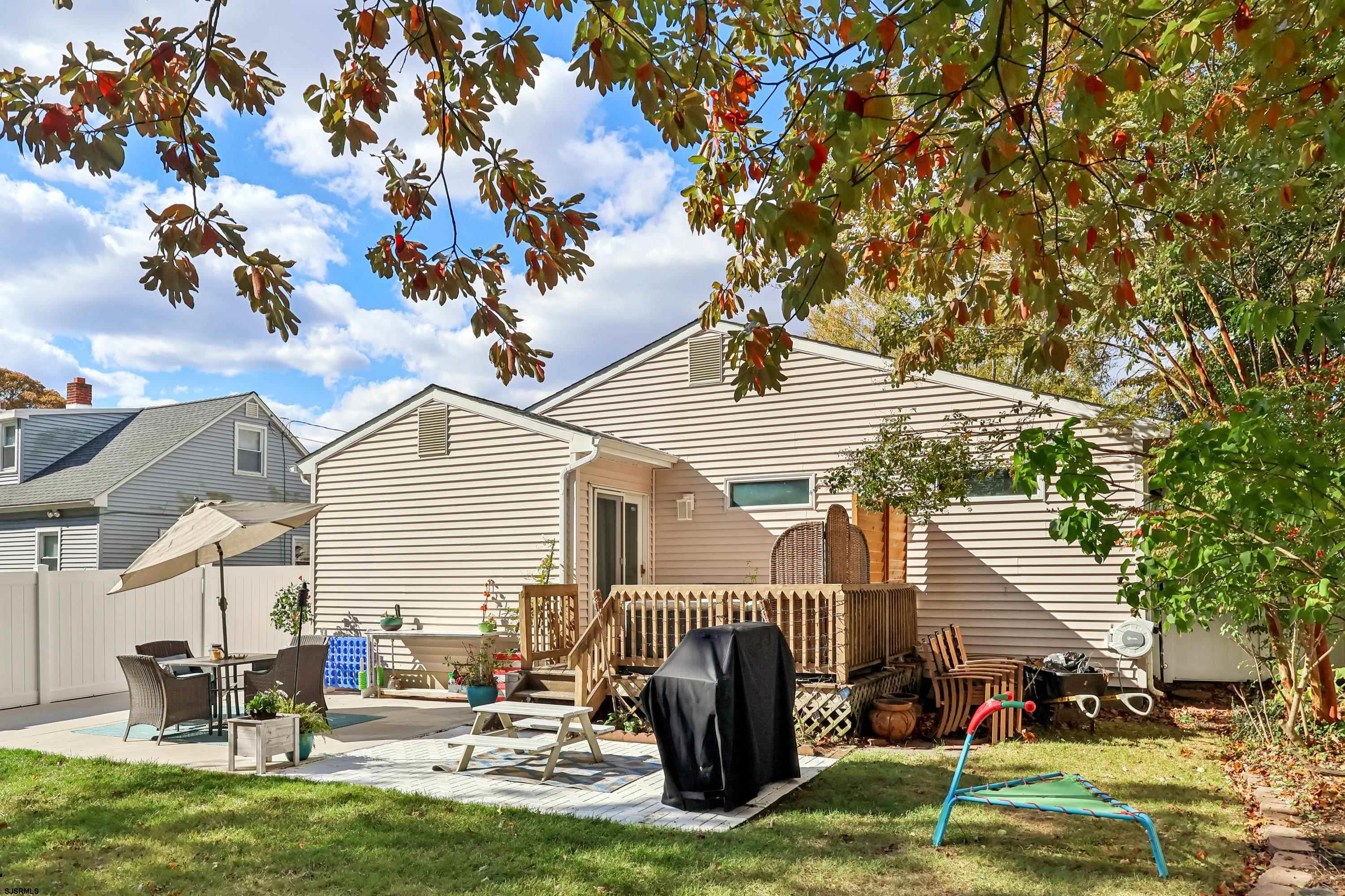 746 4th Street Somers Point, NJ 08244 - Photo 37 of 39 a backyard of a house with table and chairs
