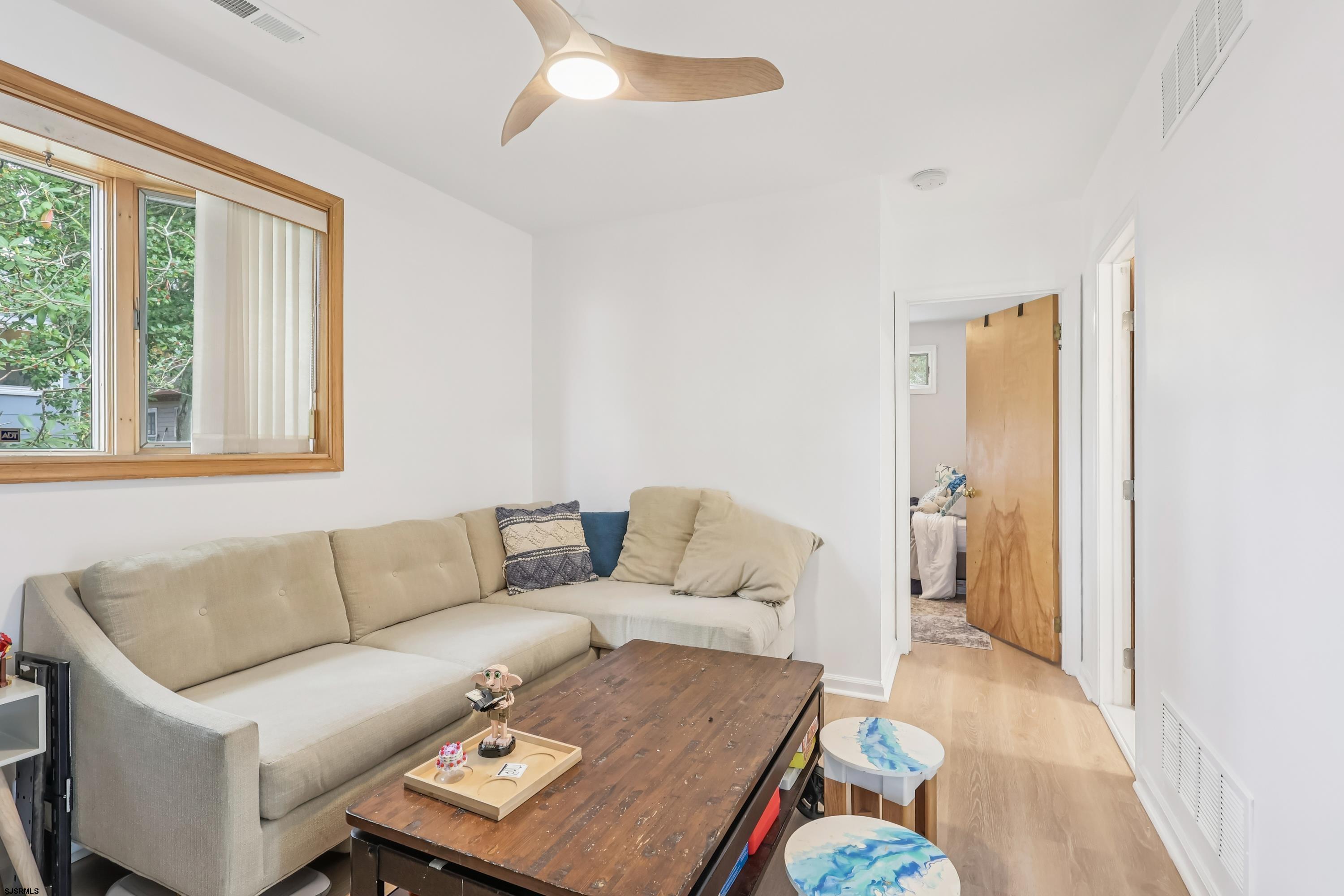 746 4th Street Somers Point, NJ 08244 - Photo 8 of 39 a living room with furniture and a window