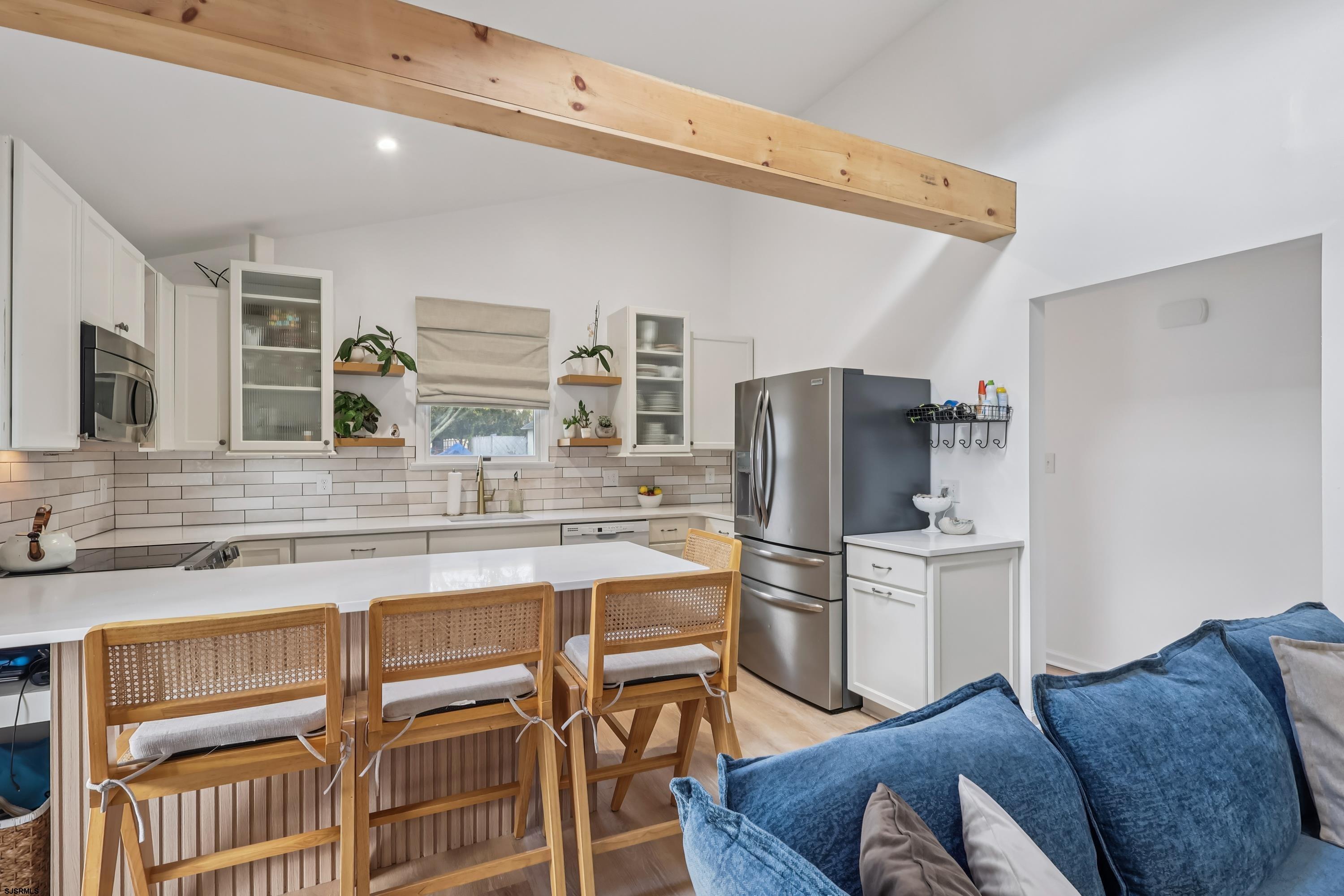 746 4th Street Somers Point, NJ 08244 - Photo 10 of 39 a kitchen with stainless steel appliances a refrigerator and cabinets