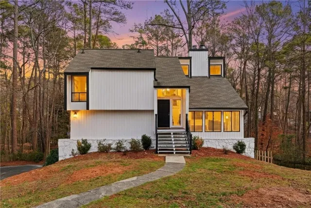 a front view of a house with a yard