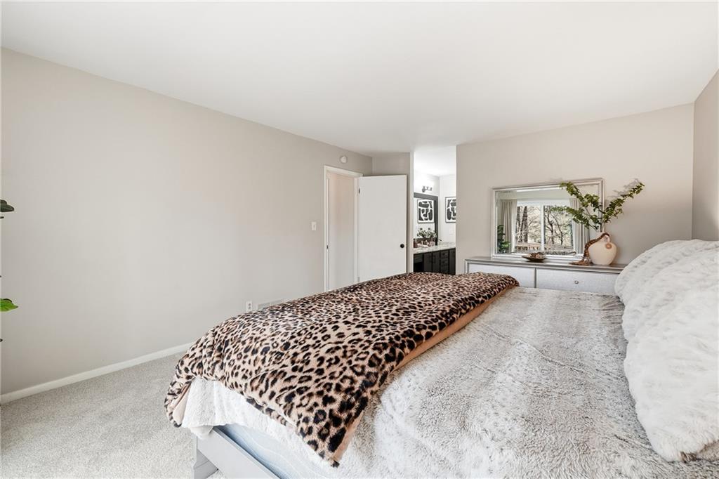 1720 Little Willeo Road Marietta, GA 30068 - Photo 12 of 26 a bedroom with a bed and window