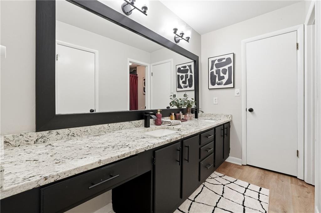 1720 Little Willeo Road Marietta, GA 30068 - Photo 13 of 26 a bathroom with a sink and a mirror
