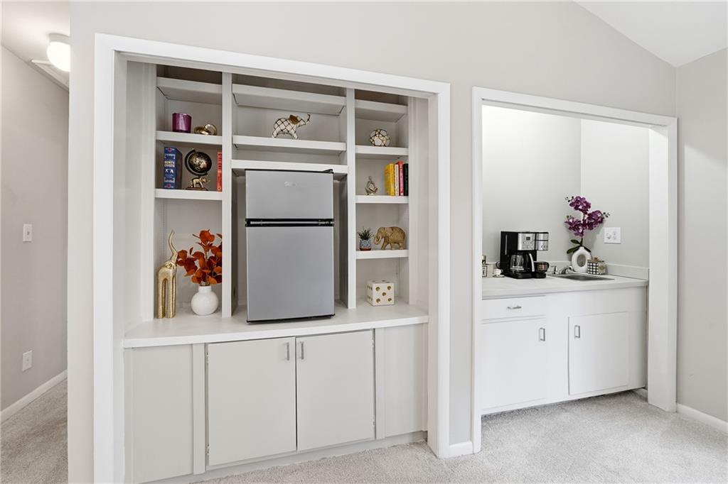 1720 Little Willeo Road Marietta, GA 30068 - Photo 17 of 26 a kitchen with cabinets and white appliances