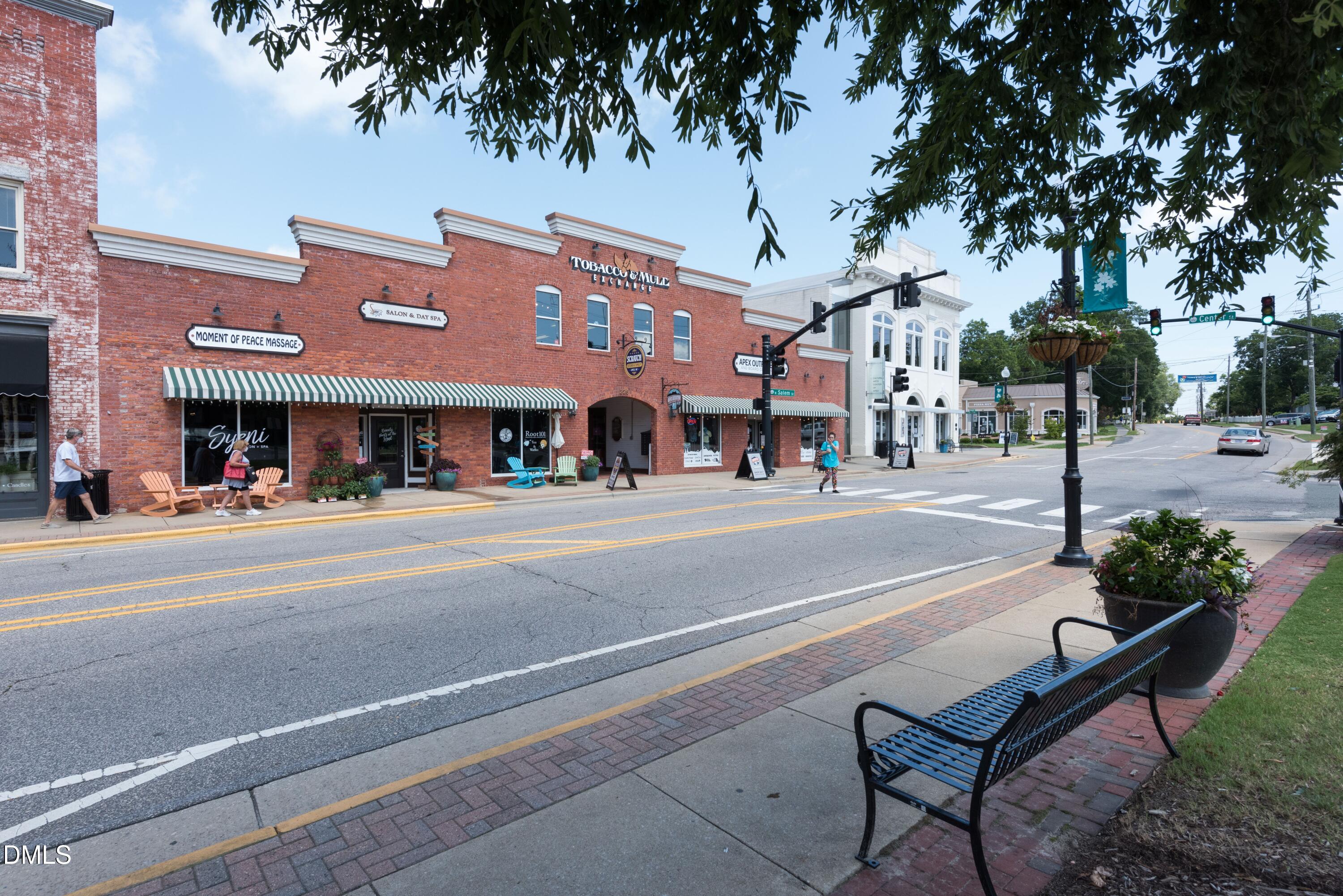 2120 Barrier Ridge Way Apex, NC 27502 - Photo 42 of 43 a view of a brick building with a bench in front of building