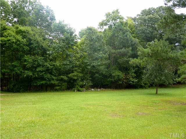 10920 Honeycutt Road, Unit 3 Raleigh, NC 27614 - Photo 1 of 5 a view of an outdoor space and a yard