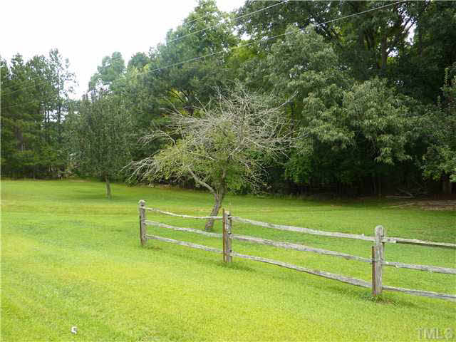 10920 Honeycutt Road, Unit 3 Raleigh, NC 27614 - Photo 4 of 5 a view of a field with grass