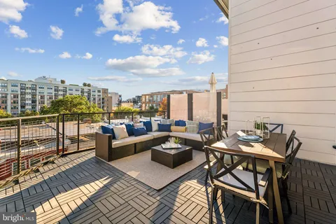 a view of a terrace with furniture