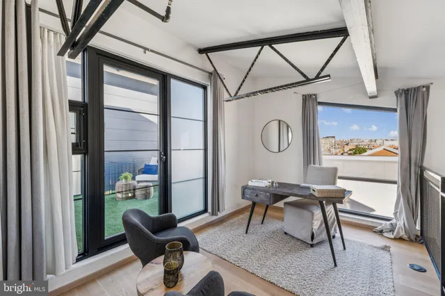 a work room with furniture and a window