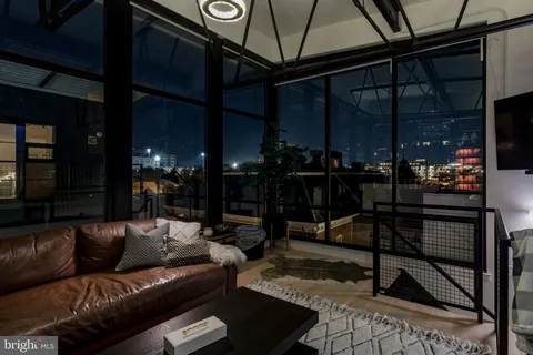 a building outdoor space with patio furniture and potted plants