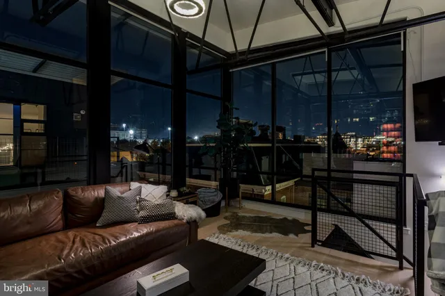 a building outdoor space with patio furniture and potted plants