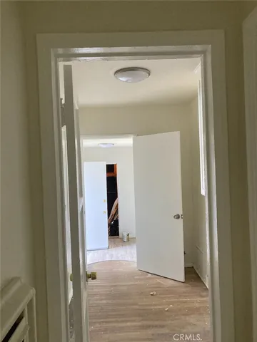 a view of a bathroom from a hallway