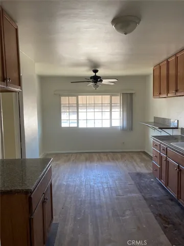 a view of a kitchen with a sink and a window