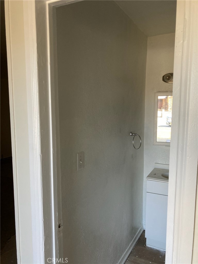 1306 South Cliveden Avenue Compton, CA 90220 - Photo 16 of 19 a bathroom with a glass shower door