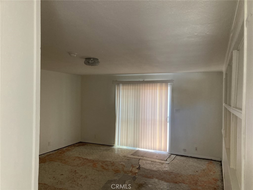 1306 South Cliveden Avenue Compton, CA 90220 - Photo 18 of 19 an empty room with windows