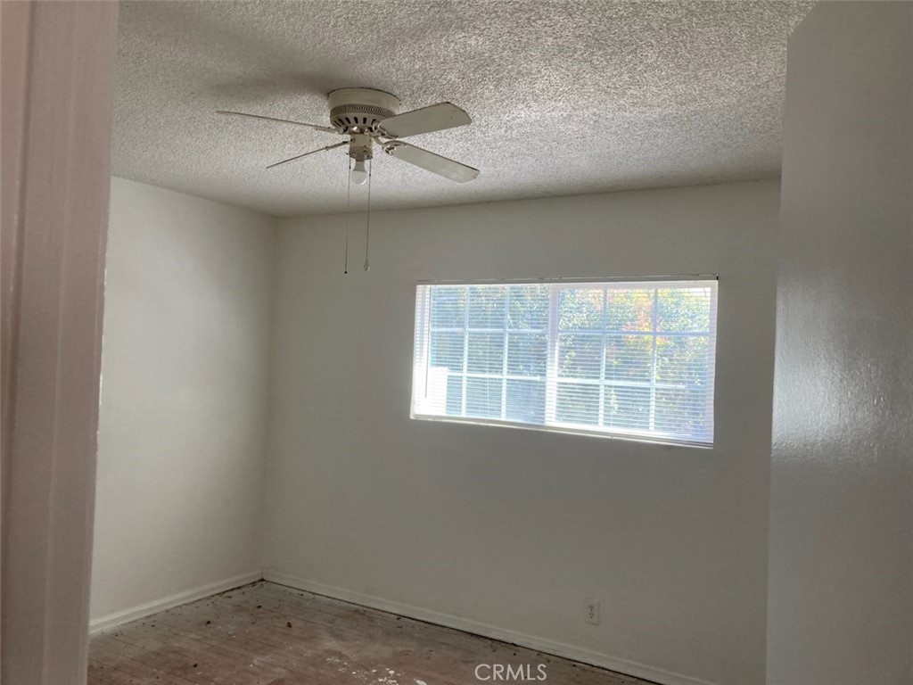 1306 South Cliveden Avenue Compton, CA 90220 - Photo 5 of 19 an empty room with a window