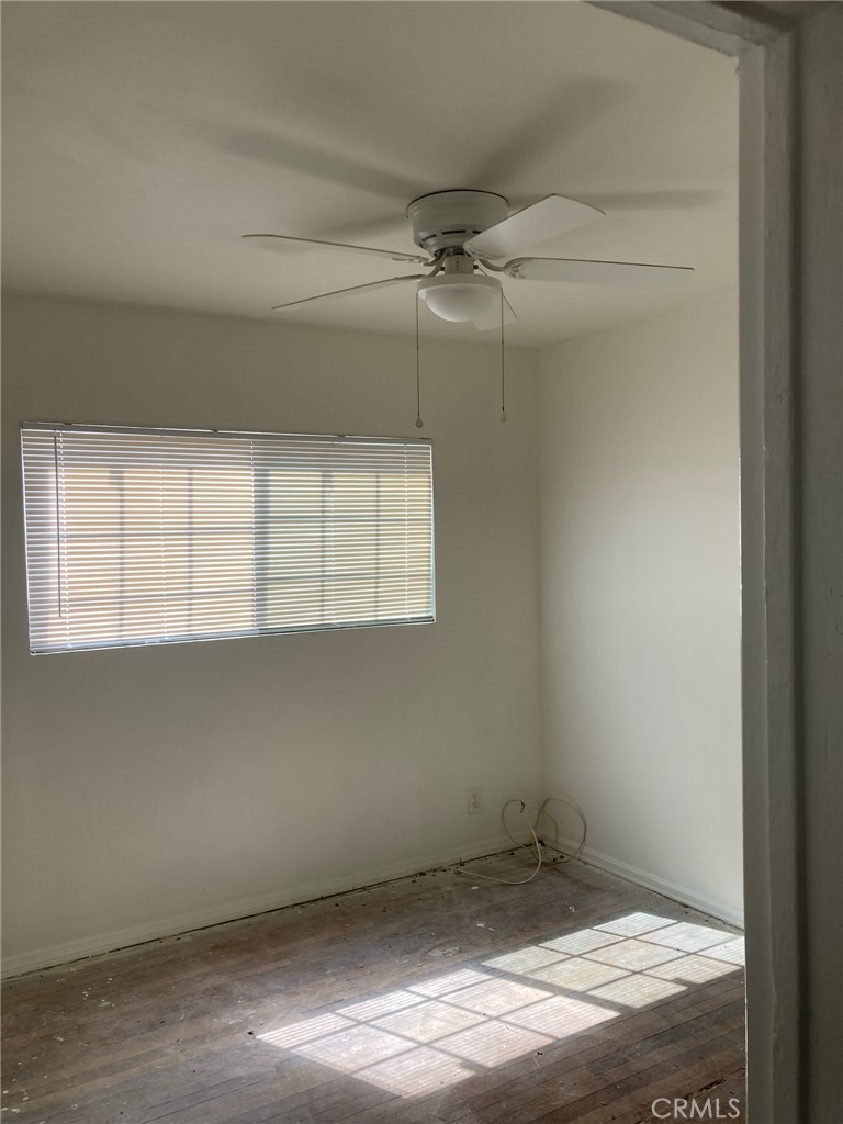 1306 South Cliveden Avenue Compton, CA 90220 - Photo 10 of 19 a view of a room with rack on the wall and a window
