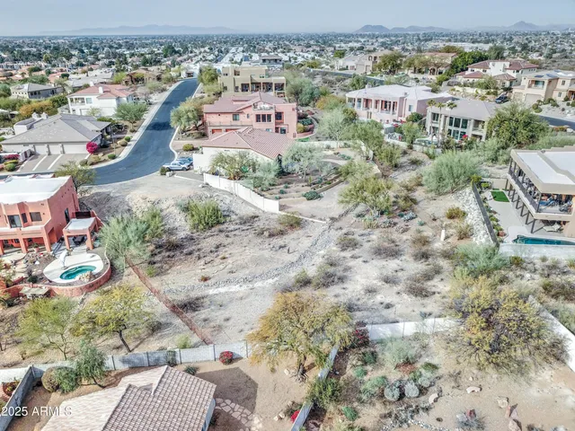 an aerial view of a houses with outdoor space