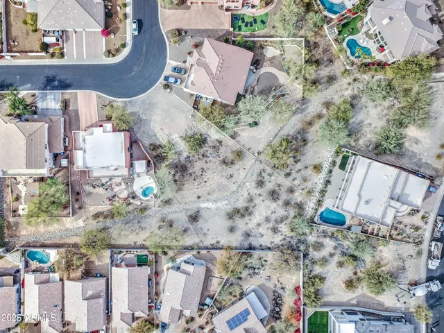 an aerial view of a house with outdoor space