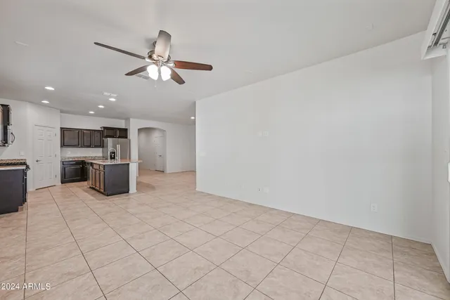 a kitchen with stainless steel appliances a refrigerator and cabinets