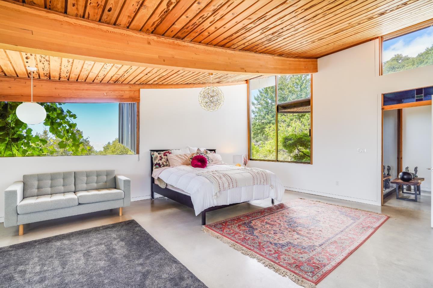 18518 Favre Ridge Road Los Gatos, CA 95033 - Photo 13 of 46 a bed room with a bed and a couch