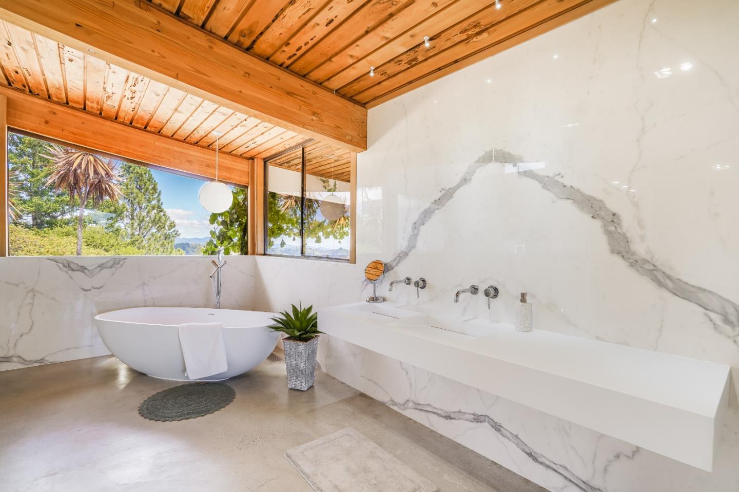 18518 Favre Ridge Road Los Gatos, CA 95033 - Photo 16 of 46 a bathroom with a sink and a bathtub