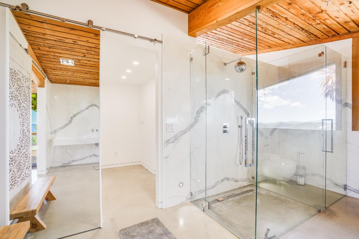 18518 Favre Ridge Road Los Gatos, CA 95033 - Photo 17 of 46 a bathroom with a glass shower door and a sink